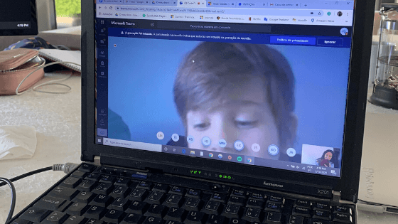 Laptop showing Microsoft Teams call with student